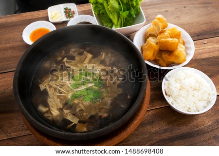 Braised pork ribs Chinese medicine in a hot pot