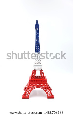 Eiffel Tower figure in France flag colours isolated on white background. 