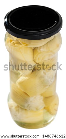 Picture of glass jar with preserved marinated artichokes, nobody. Isolated over white background