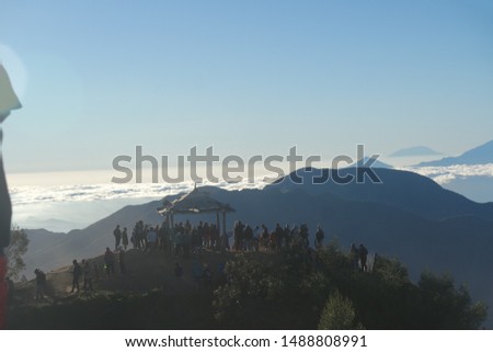 Many people hunting Sunrise at Dieng with landscape mountains