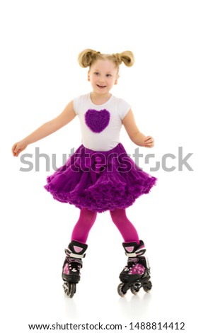 Little girl on roller skates.