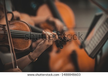 String quartet with cello in the background - Wallpaper, Background Royalty-Free Stock Photo #1488848603