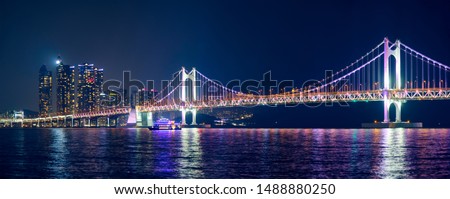 Panorama of Gwangan Bridge and skyscrapers illuminated in the night. Busan, South Korea Royalty-Free Stock Photo #1488880250