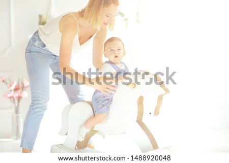 child rocking horse / little boy riding a toy horse, rocking chair children's toy vintage