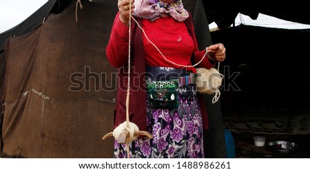 Anatolian woman spinning wool, old crafts,  goat hair