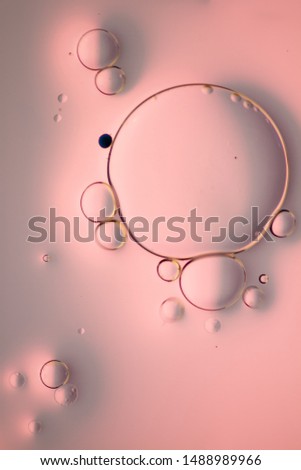 Abstract macro photography of oil and water with color.