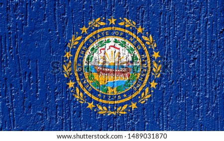 Flag State of New Hampshire close up painted on a cracked wall