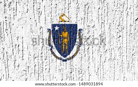 Flag State of Massachusetts close up painted on a cracked wall