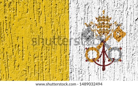 Flag of Vatican city Holy see close up painted on a cracked wall