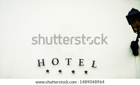 Sign luxury hotel detail hotel four stars luxury and elegance. 4 large metal stars and the word hotel