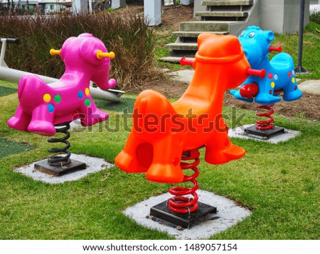 Rocking horse on playground shot