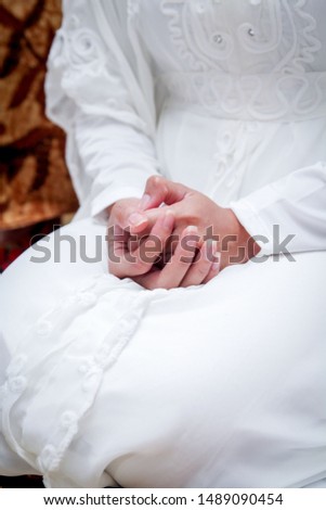 Woman Hands Resting on Lap