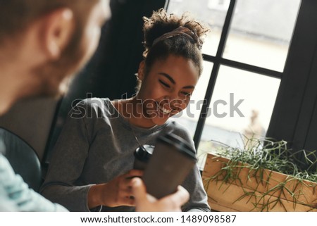 Positive vibes. Man and woman have a meeting in a modern cafe