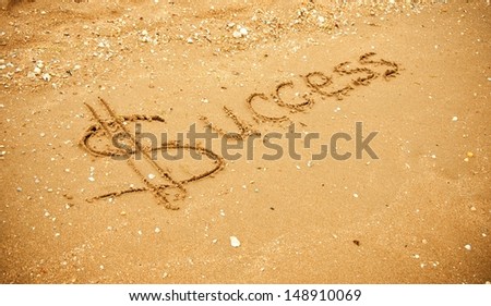"Success" written in the sand 