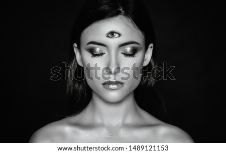 Woman with third eye on head - supernatural sense concept. Royalty-Free Stock Photo #1489121153