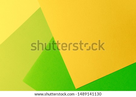 Multi colored abstract paper of pastel colors, with geometric shape, flat lay.