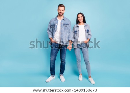 BEAUTIFUL COUPLE WEARING A JEANS JACKET 