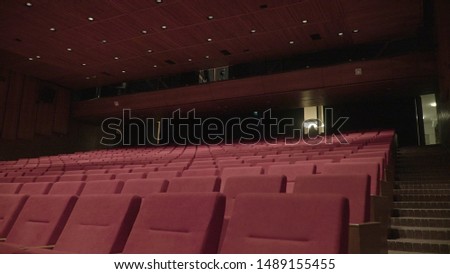 Movie Theater Seats. Close-up photo of rows of red seats in the cinema. Event concert 