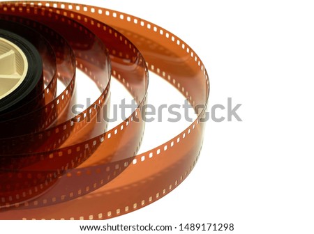 Roll of 35mm film on white background.35 mm  film  negative on white background.Use as illustration for presentation.                                 