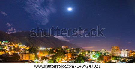 Night view of Caracas, under a full Moon
