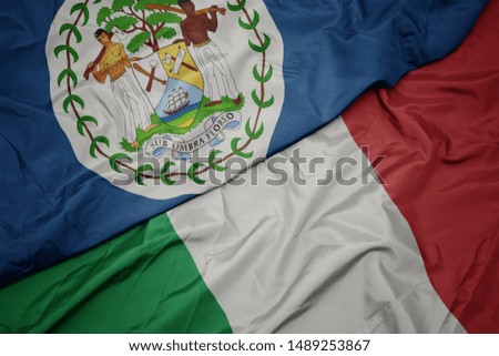 waving colorful flag of italy and national flag of belize. macro