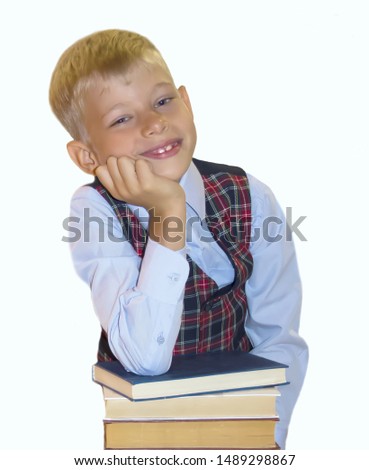Schoolboy with books on a white background.Isolate.First time in school. Back to school. - Image