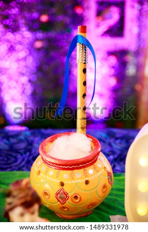 krishna pot / Butter pot. Pot Full Of Butter with Flute. Krishnastami Special. idol of lord Bala krishna. krishan janamashtami, krishna jayanti. Venna Donga - Image