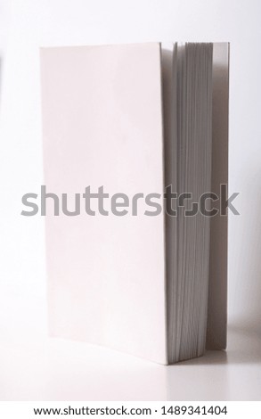 white book on white table