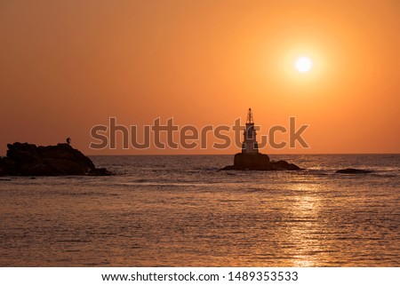 
Photographer shooting beautiful sunrise. Landscape from the Black Sea, Bulgaria, Ahtopol lighthouse.