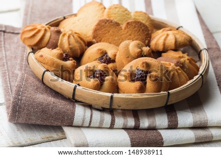 Different cookies on wooden background. Selective focus.