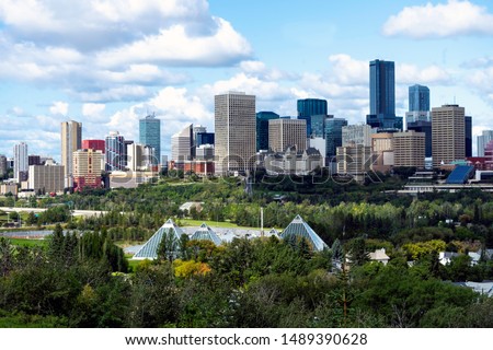 Stunning view of downtown Edmonton, Alberta, Canada. Taken on sunny summer day from a hill across the North Saskatchewan river. Royalty-Free Stock Photo #1489390628