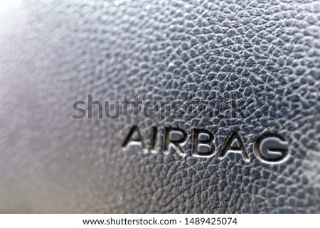 close-up of the inscription "airbag" on the car panel