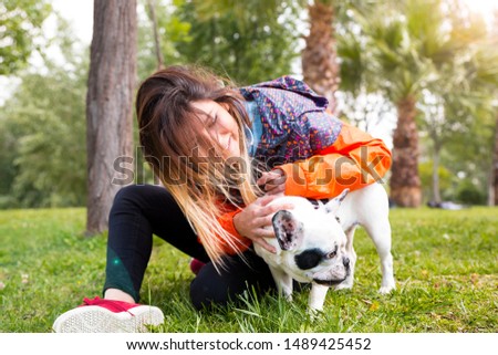 Young woman and her dog enjoying in the nature stock photo