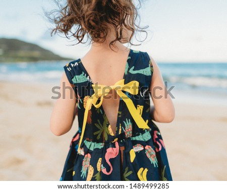 Dancing in the beach wind in a Hawaii dress