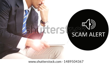 Scam Alert concept with young man working with laptop on white background