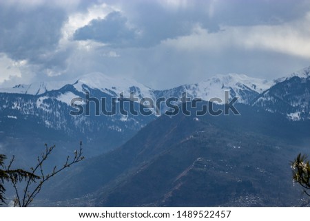 Snow at hills with tree and sky image is taken at manali india showing it amazing natural view.