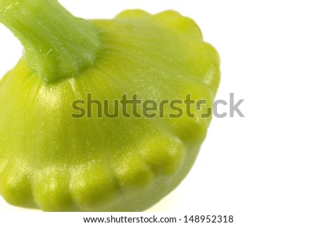Funny shape of single green vivid ripe pattypan squash isolated on white background. 