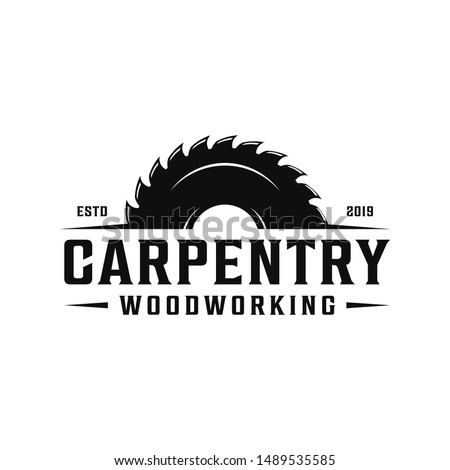 Carpentry, woodworking retro vintage logo design. Sawmill / saw logo Royalty-Free Stock Photo #1489535585