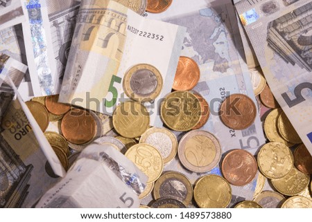 Euro money: closeup of banknotes and coins flat lay