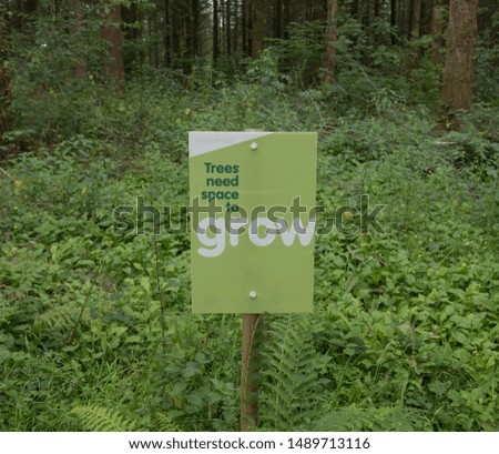 "Trees Need Room to Grow" Sign on the Edge of a Forest in Rural Devon, England, UK