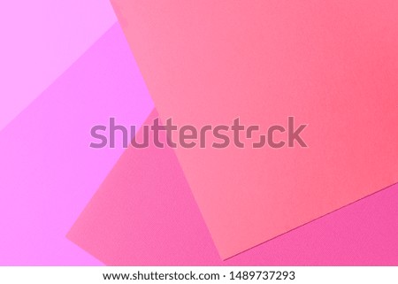 Multi colored abstract paper of pastel colors, with geometric shape, flat lay.
