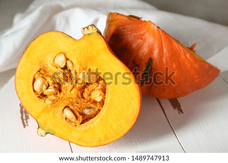 Cut pumpkin on white board