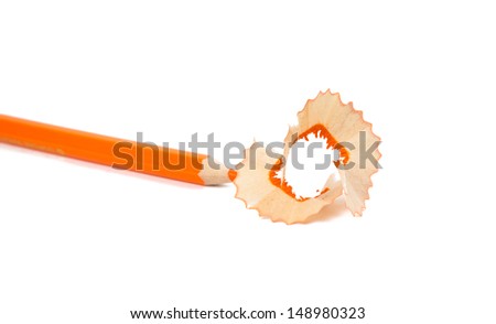 orange pencil shavings on white background