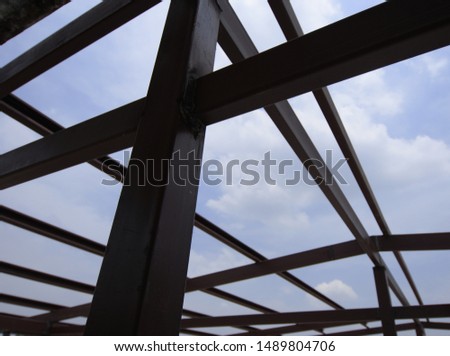 Unfinished steel structure for modern building, rust protected primer on iron bar for exterior use