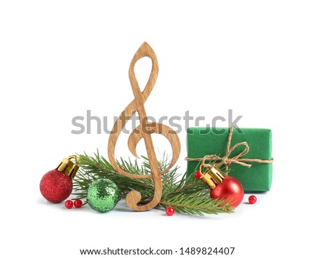 Treble clef with decorations isolated on white. Christmas music concept
