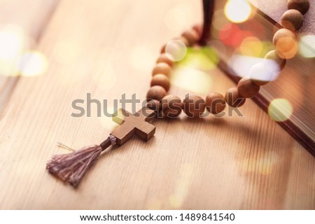 Catholic rosary beads and bible