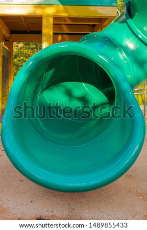 Slide at a playground on a fall day.