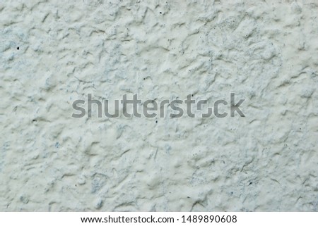 Part of the wall, plaster with cracks. Close-up.