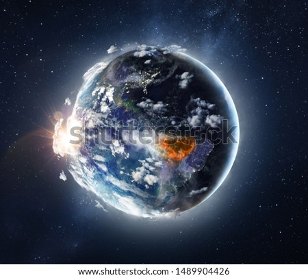 Amazon tropical forest in fire, conceptual photo manipulation of planet Earth. Elements of this image are furnished by NASA