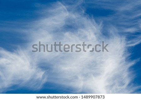 Image of blue sky with white clouds.